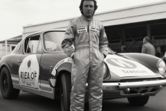 johannes.wessels_portrait_full_body_racing_driver_in_overalls_f_6245c711-34ec-4c28-a465-b61d931acce0