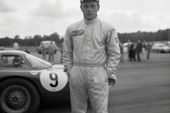 johannes.wessels_portrait_full_body_racing_driver_in_overalls_f_ff6473cc-ddbc-4f48-a5d4-a9f6ed0a2799